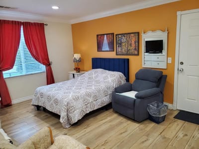 Well-furnished private resident room with warm decor
