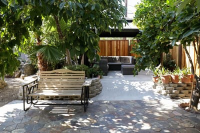 A serene outdoor space with seating and plants