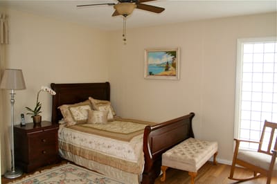 Cozy private room with a bed and seating area
