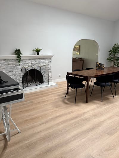 Cozy common area with dining table and fireplace