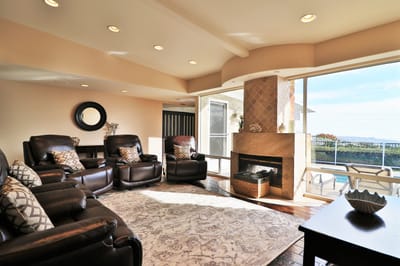 Cozy common area with leather recliners and natural light