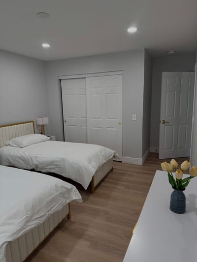 Brightly lit twin bedroom in a modern facility