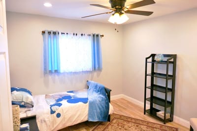 Cozy private room with blue decor and natural light