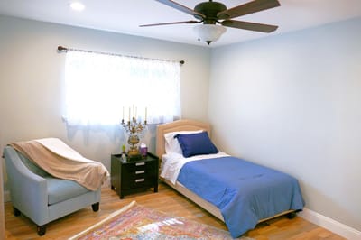 Cozy private resident room with bed and sitting area