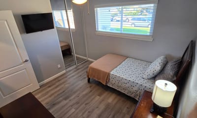 Cozy private resident room with bed and TV