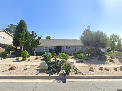 Exterior view of a senior care facility with landscaping