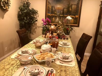 Dining table set with food and decorations