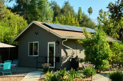 Exterior view of a facility building with solar panels
