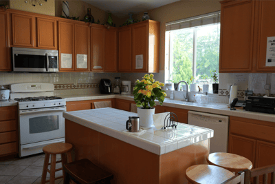 Bright kitchen interior with flowers on the counter