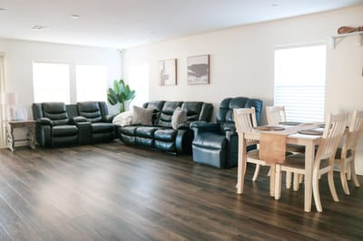 Bright common area with seating and dining space