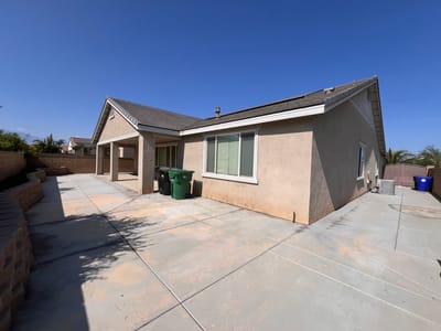 Exterior view of a residential building with a patio