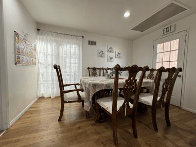 Interior dining area with a large table and chairs