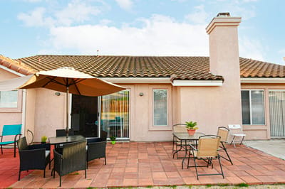 Outdoor patio with seating and umbrella