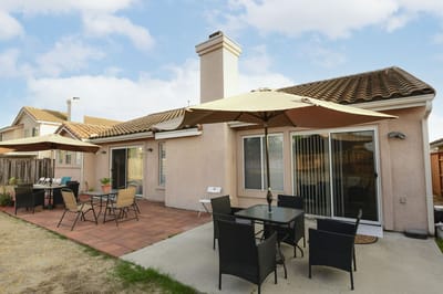Outdoor patio area with seating and umbrellas