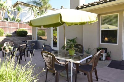 Outdoor seating area with tables and chairs