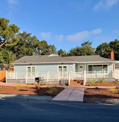 Exterior view of a senior living facility with landscaping