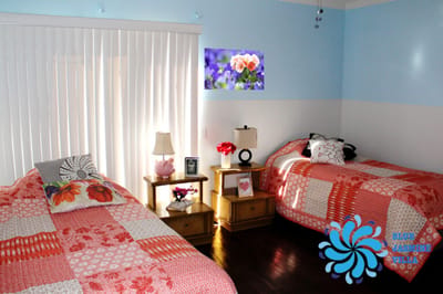 Cozy shared bedroom with floral decor