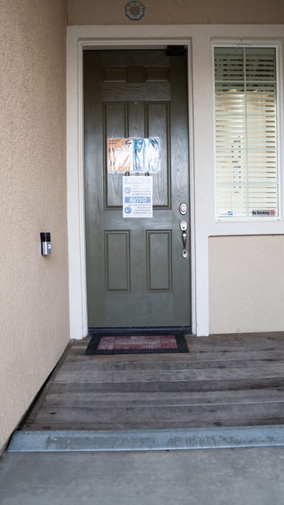Entrance door with signage and ramp