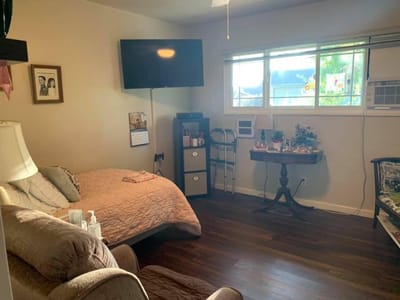 Cozy resident room with bed and TV