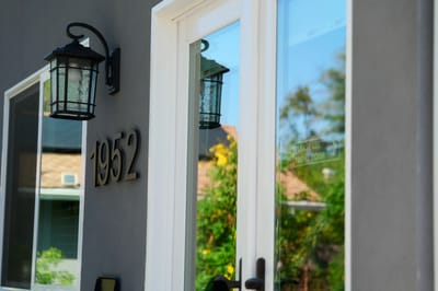 Entrance view of Azalea House with a house number