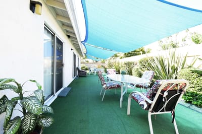 Outdoor patio area with tables and chairs