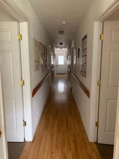 Interior hallway with doors and bright lighting
