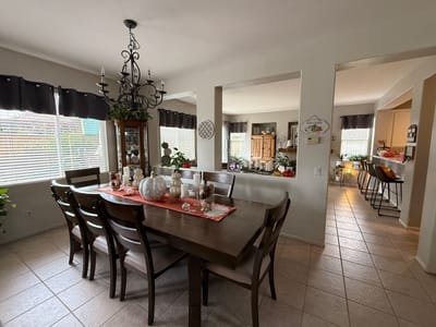 Interior dining room with a large table and decor