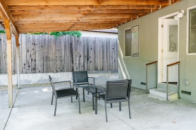 Outdoor patio seating area with chairs and table