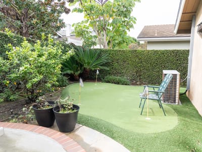 Small outdoor putting green in a garden area