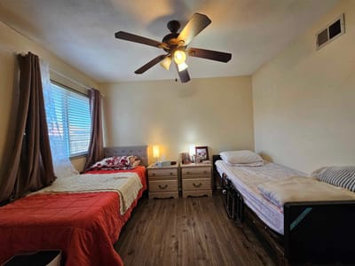 Private resident room with two beds and decor