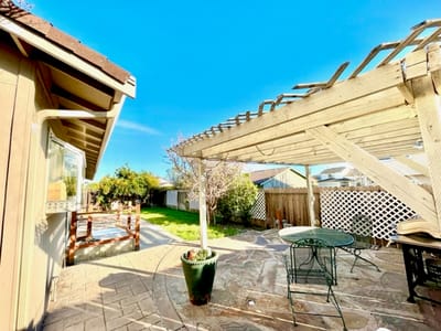 Outdoor patio area with seating and sunny sky