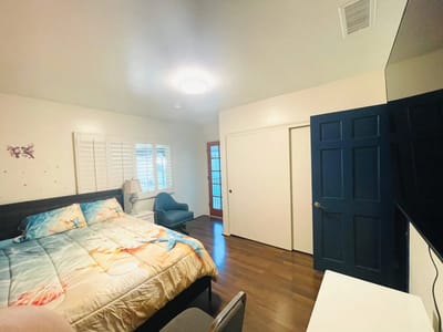 Private resident room with bed and chair