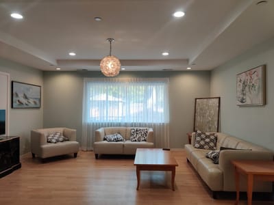 Bright common area with seating and artwork