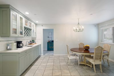 Bright kitchen area with a dining table and chairs