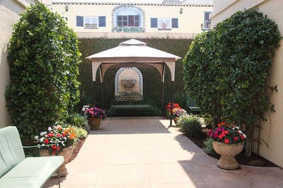 A peaceful outdoor garden area with seating