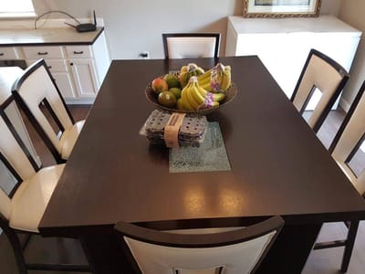 Dining table with fruit and a fruit bowl