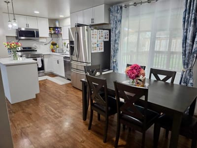 Bright and modern kitchen interior with dining table