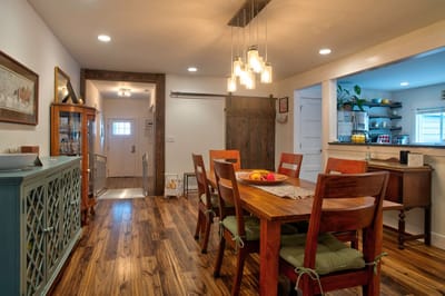 Bright dining room with wooden table and chairs