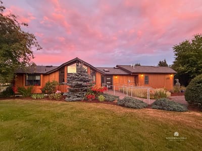 Exterior view of Wisteria Lodge during sunset