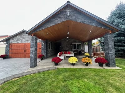 Exterior view of a senior living facility with colorful flowers