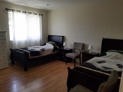 Bright, shared resident room with twin beds