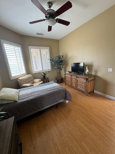 Private resident room with bed and furniture