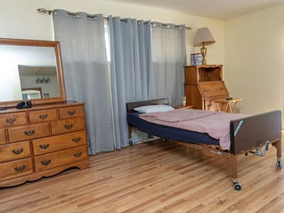 Private resident room with bed and furniture