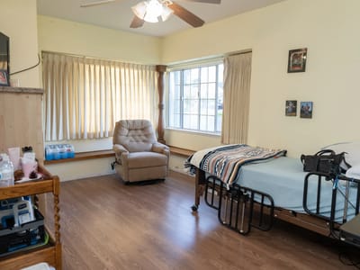 Cozy resident room with a bed and seating area
