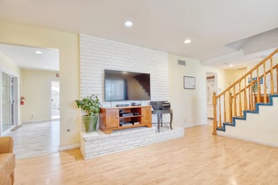 Bright common area with a TV and seating