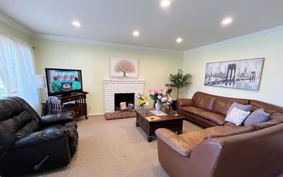 Bright common area with cozy seating and decorations