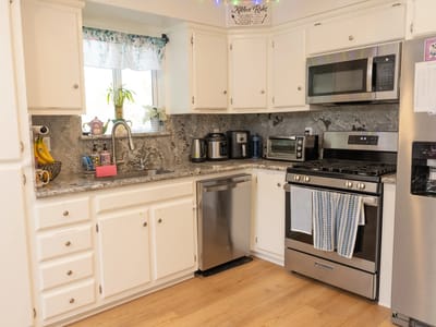 Modern kitchen with appliances and granite countertops