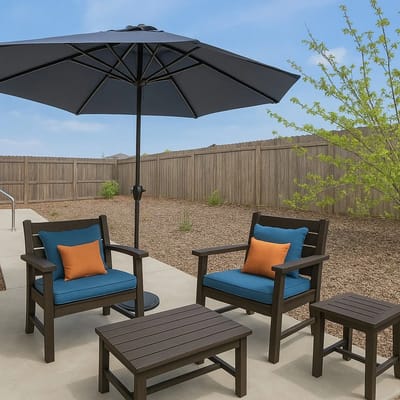 Outdoor seating area with chairs and umbrella
