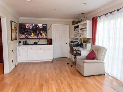 Bright activity room with a television and workspace