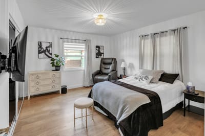 Well-furnished resident room with cozy decor